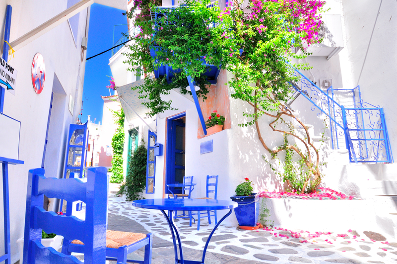 Typical greek traditional village with colorful bougainvilla, Skiathos Island, Greece